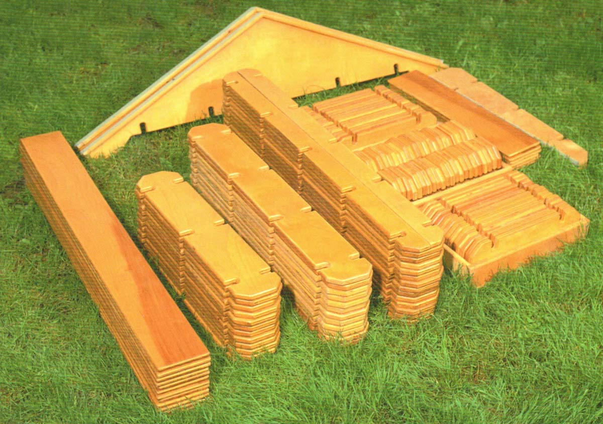 unassembled builder boards lying in the grass