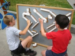 kids playing with marble roller